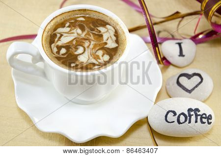 White Cup Of Coffee With Decorated Foam