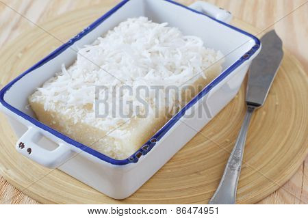 Sweet Couscous (tapioca) Pudding (cuscuz Doce) With Coconut On Wooden Table