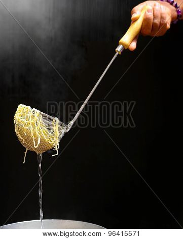 Cooking Egg Or Yellow Noodle In Hot Water