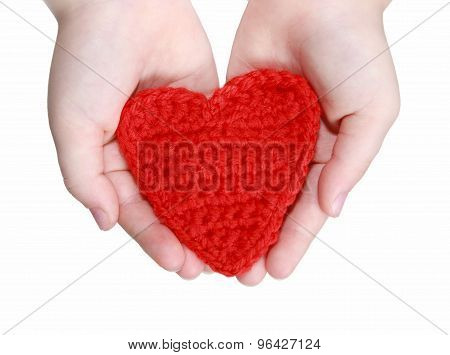 red crocheted heart in hands