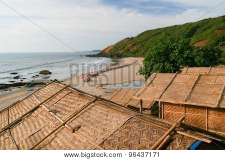 Straw hut roofs and beach view goa india
