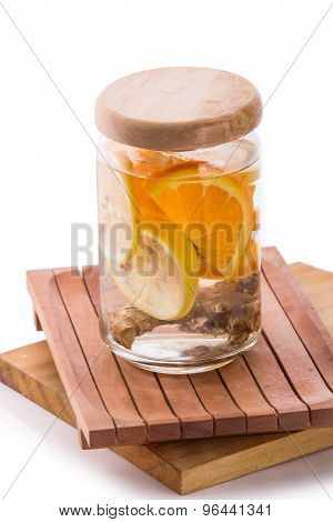 Infused Fresh Fruit Water Of Orange, Citrus And Ginger.isolated Over White