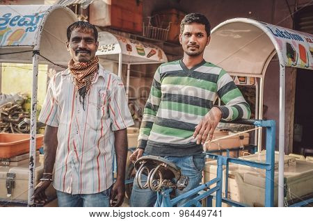 KAMALAPURAM, INDIA - 02 FABRUARY 2015: Indian ice-cream vendors on a market close to Hampi. Post-processed with grain, texture and colour effect.