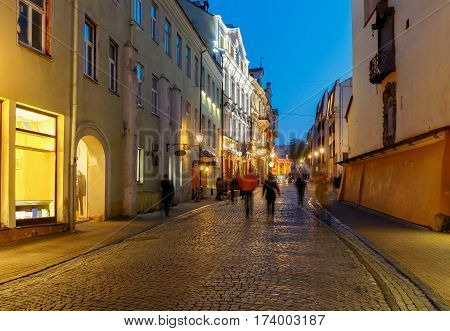 Street in night lighting in the historic center of the old town. Lithuania. Vilnius.