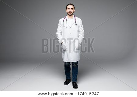 Full length young medical doctor on white background