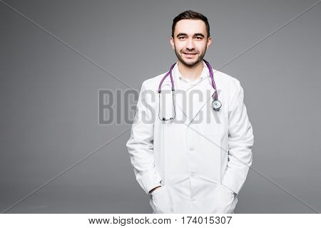 Portrait young medical doctor on grey background