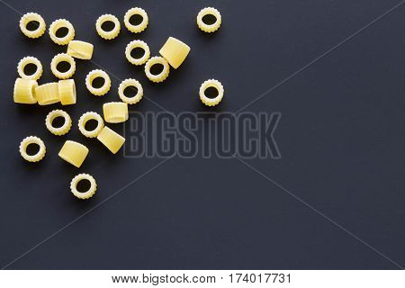 Pasta Rings On A Black Background