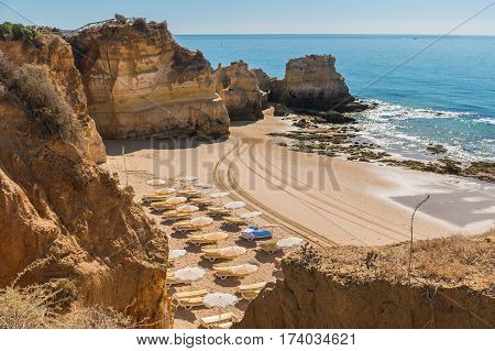 Scenic golden cliffs near Alvor Portimao. This beach is a part of famous tourist region Algarve