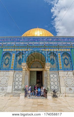 JERUSALEM, ISRAEL - MAY 23, 2016: Visitors at the entrance of the Dome of the Rock is an Islamic shrine located on the Temple Mount in the Old City.