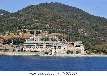 Orthodox Greek monastery on Mount Athos. View from sea. Xenophon.