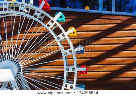 Layout part ferris wheel on a wooden background with free space