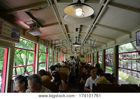 Japanese People And Traveler Foreigner Tour On Sagano Scenic Railway For Looking View Of Hozugawa Ri