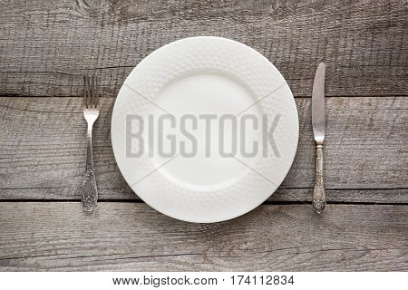 Elegance table setting on wooden board. Rustic stile. Romantic dinner. Top view.