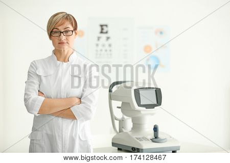 Mature female ophthalmologist in clinic