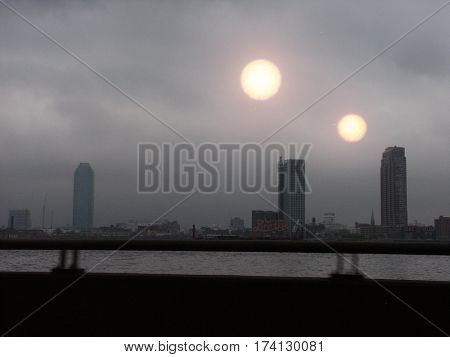Two suns above promenade.