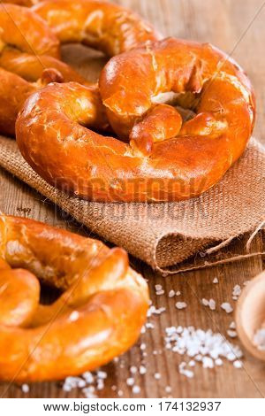 Group of bavarian pretzels on wooden table.