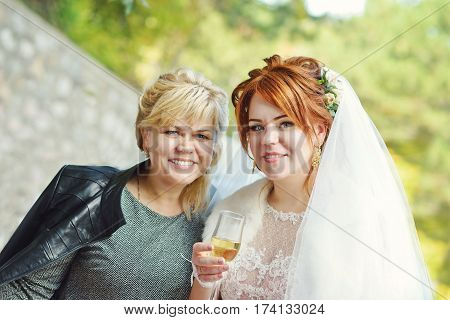 redhead pretty bride with her attractive mother