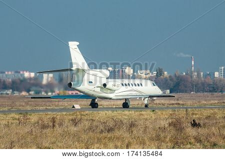 Kiev Ukraine - November 5 2011: Dassault Falcon 50EX business jet is taking off from the runway on a sunny autumn day