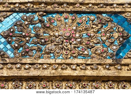 Gloden flower stucco with the glass mosaic on the church wall. (Public area not required Property Release)