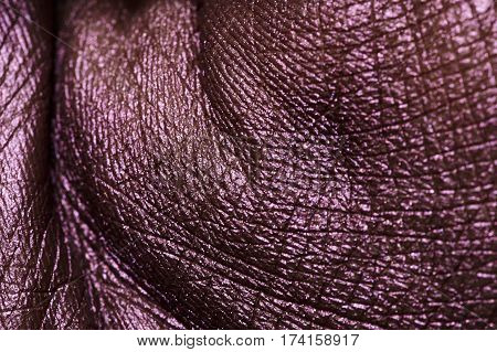 Creasy purple painted Palm Skin. Macro Texture with Wrinkles