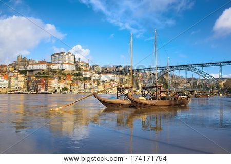 Porto old town cityscape on the Douro River with traditional Rabelo boats. Portugal