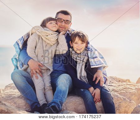 Spring portrait of cute happy family outdoors
