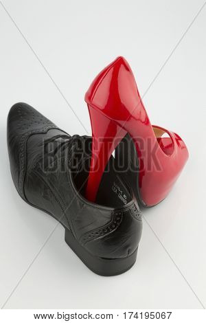 red high heels and men's shoe
