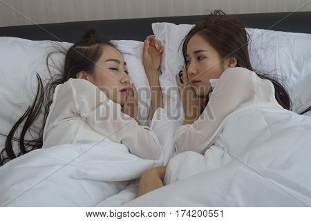 Lovely lesbian coupletwo sexy women on the bed lesbian in love at valentine day.