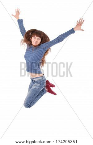Full length portrait of a cheerful girl jumping isolated on a white background