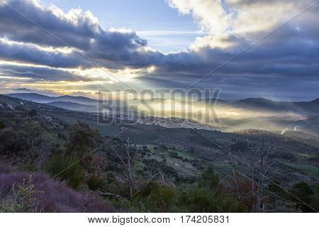 Stunning overview of Guadalupe village during a foggy sunrise Caceres Spain