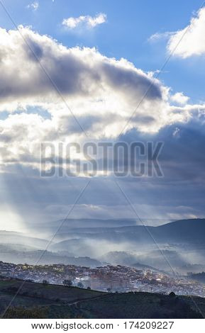 Stunning overview of Guadalupe village during a foggy sunrise Caceres Spain