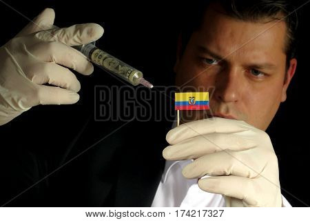 Young Businessman Gives A Financial Injection To Ecuadorean Flag Isolated On Black Background