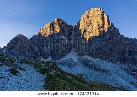 via ferrata, sunny morning in the mountains. Dolomites, green valley