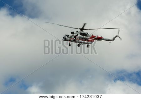 Kamchatka Peninsula, Russia - August 20, 2016: Sightseeing helicopter MI-8 for tourists in the cloudy sky