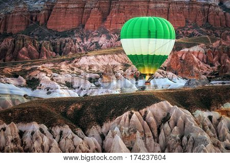 Balloon silhouette in the sunrise sky. Cappadocia, Turkey