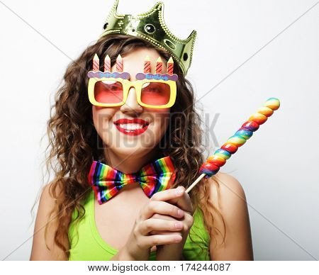 Young woman having fun. Young pretty woman with crown is laughin