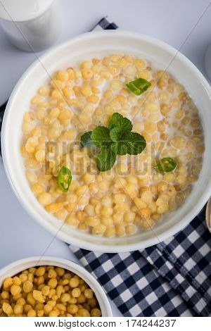Dahi Bundi or Boondi Raita, favourite indian started or side dish made using Rajasthani snack food made from sweetened, fried chickpea flour, called Boondi with sweet and salty curd or buttermilk