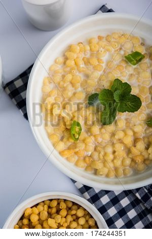 Dahi Bundi or Boondi Raita, favourite indian started or side dish made using Rajasthani snack food made from sweetened, fried chickpea flour, called Boondi with sweet and salty curd or buttermilk