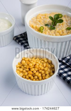 Dahi Bundi or Boondi Raita, favourite indian started or side dish made using Rajasthani snack food made from sweetened, fried chickpea flour, called Boondi with sweet and salty curd or buttermilk