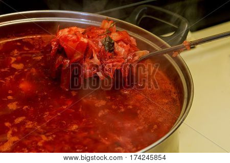Ukrainian borsch cooking Traditional Ukrainian dish - borsch, close up in a bowl