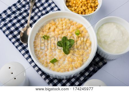 Dahi Bundi or Boondi Raita, favourite indian started or side dish made using Rajasthani snack food made from sweetened, fried chickpea flour, called Boondi with sweet and salty curd or buttermilk