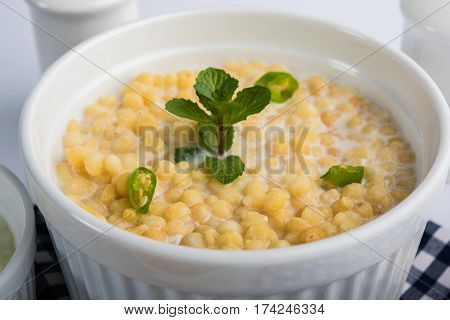 Dahi Bundi or Boondi Raita, favourite indian started or side dish made using Rajasthani snack food made from sweetened, fried chickpea flour, called Boondi with sweet and salty curd or buttermilk