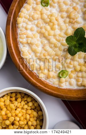 Dahi Bundi or Boondi Raita, favourite indian started or side dish made using Rajasthani snack food made from sweetened, fried chickpea flour, called Boondi with sweet and salty curd or buttermilk