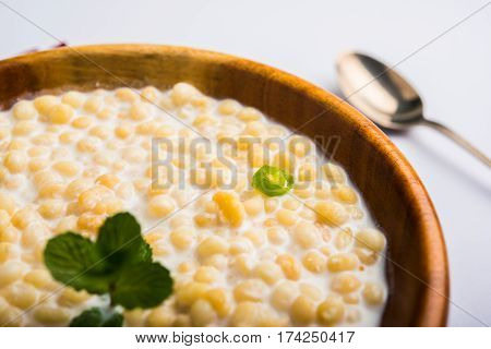 Dahi Bundi or Boondi Raita, favourite indian started or side dish made using Rajasthani snack food made from sweetened, fried chickpea flour, called Boondi with sweet and salty curd or buttermilk