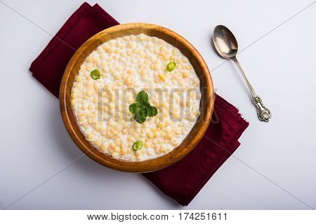 Dahi Bundi or Boondi Raita, favourite indian started or side dish made using Rajasthani snack food made from sweetened, fried chickpea flour, called Boondi with sweet and salty curd or buttermilk