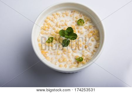 Dahi Bundi or Boondi Raita, favourite indian started or side dish made using Rajasthani snack food made from sweetened, fried chickpea flour, called Boondi with sweet and salty curd or buttermilk