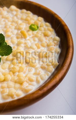 Dahi Bundi or Boondi Raita, favourite indian started or side dish made using Rajasthani snack food made from sweetened, fried chickpea flour, called Boondi with sweet and salty curd or buttermilk