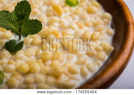 Dahi Bundi or Boondi Raita, favourite indian started or side dish made using Rajasthani snack food made from sweetened, fried chickpea flour, called Boondi with sweet and salty curd or buttermilk