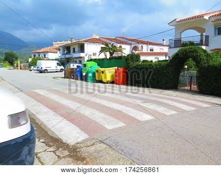 Bermejo Spain - February 24 2017: Colorful collection of rubbish bins in village street