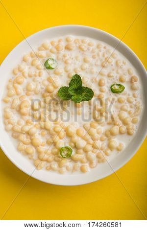 Dahi Bundi or Boondi Raita, favourite indian started or side dish made using Rajasthani snack food made from sweetened, fried chickpea flour, called Boondi with sweet and salty curd or buttermilk